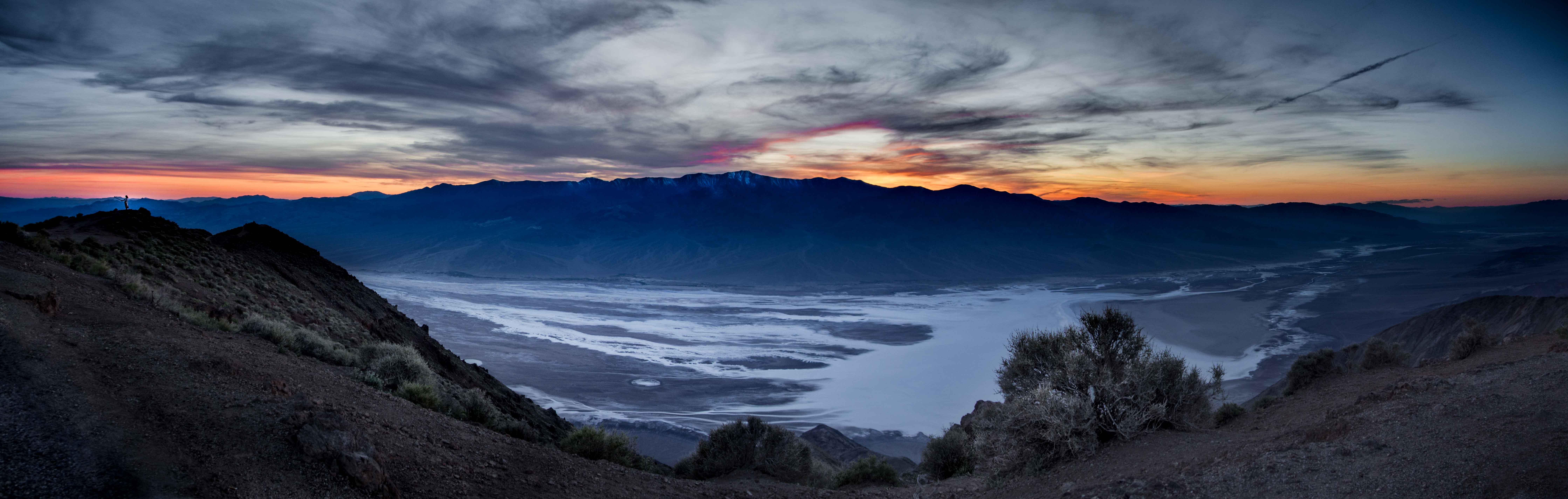 A panorama of a sunset's last breath over the salt flats of Death Valley.